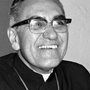 black and white photo of Oscar Romero laughing