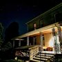 warmly lit front porch in Fox Hill